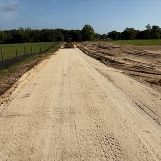 Compacted road base with dozer working ahead