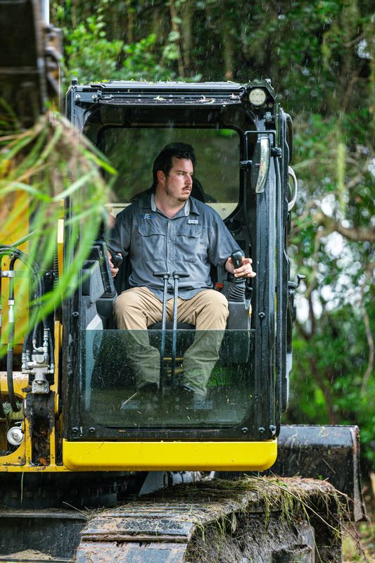 Sam Adams at the controls of his CAT excavator